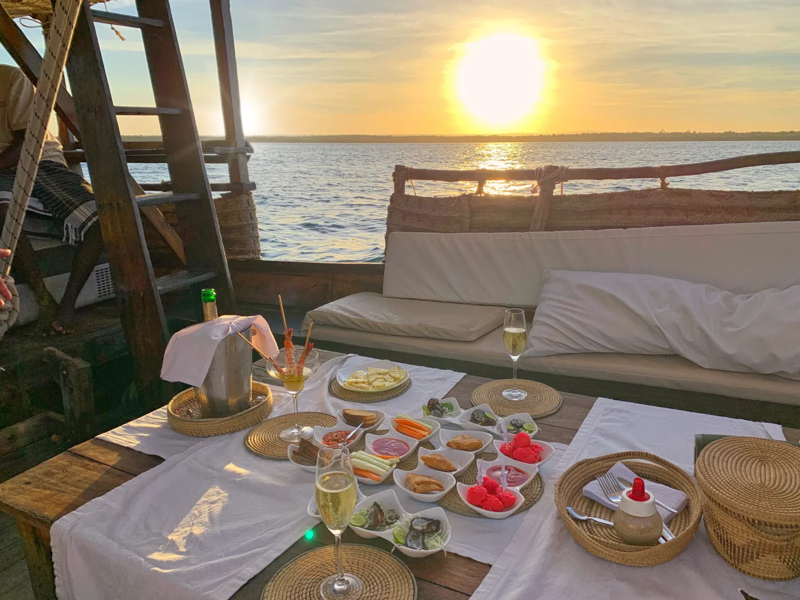 A table laid on the dhow's deck for the sunset aperitivo