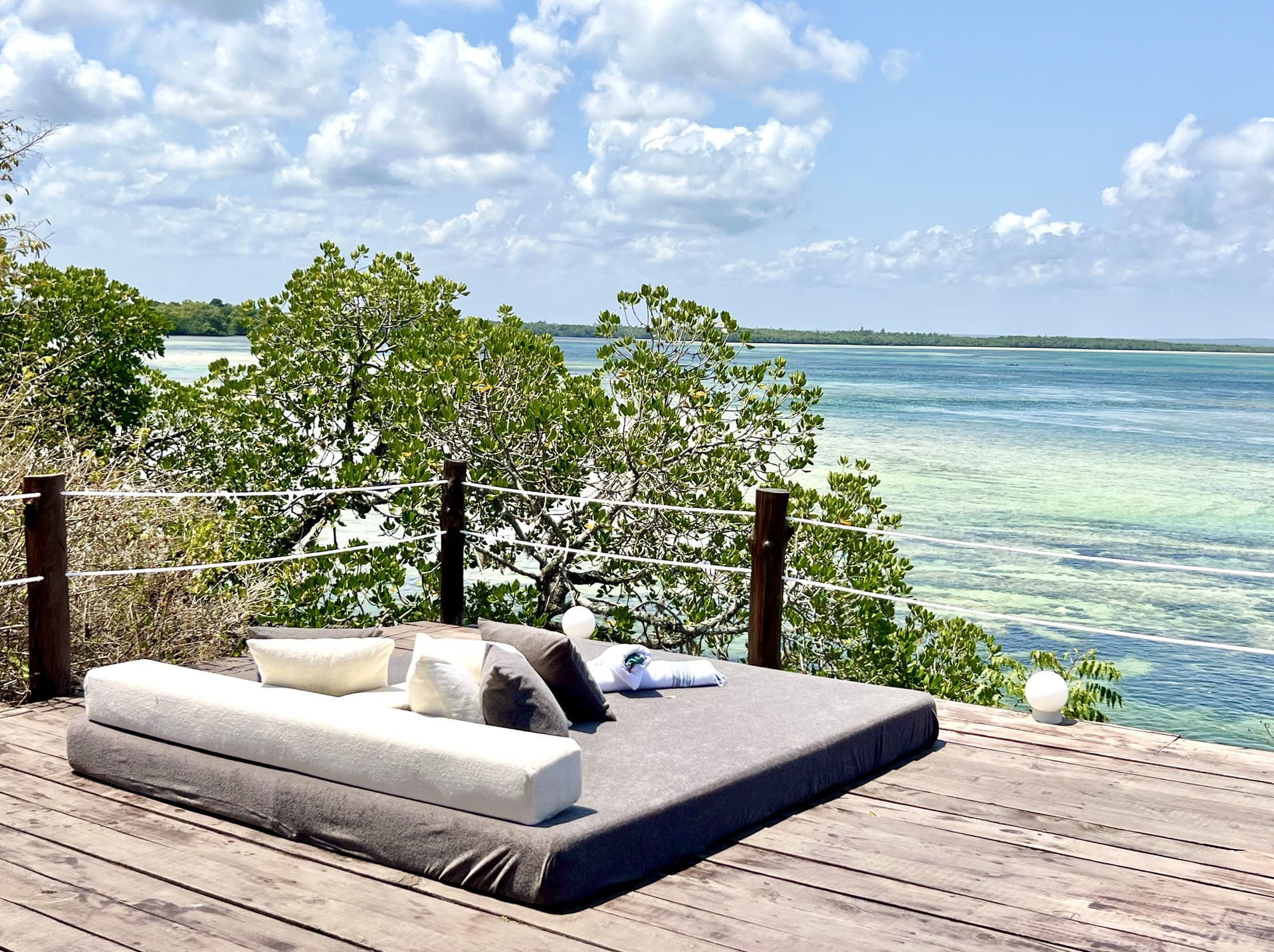 The Imperial Banda suite with its wide wooden terrace looking out over Mida Creek and the ocean