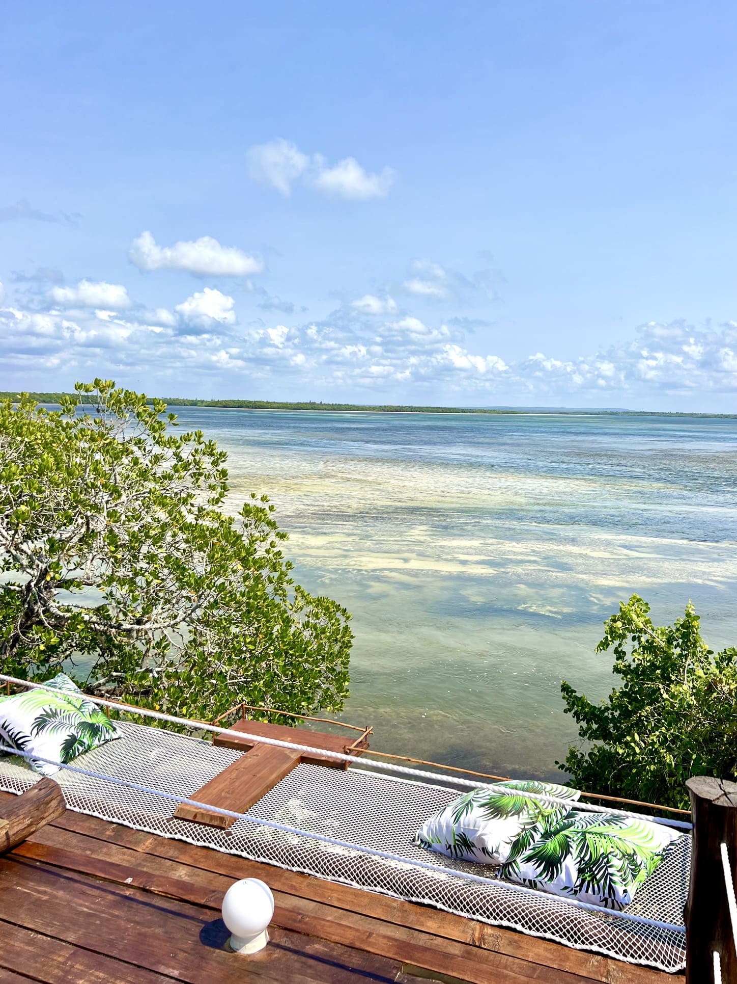 The Imperial Banda suite with its wide wooden terrace looking out over Mida Creek and the ocean